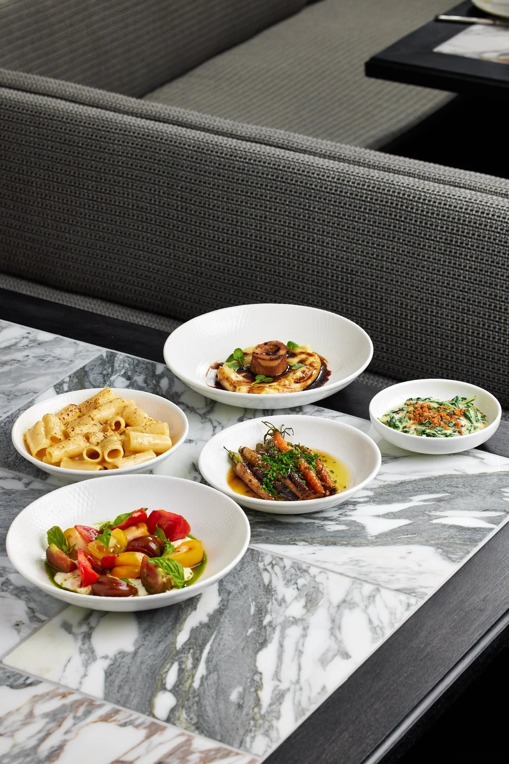 Rich & Rare steakhouse table with official food photography